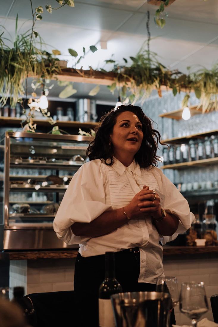 Victoria Howe speaking to a room of people